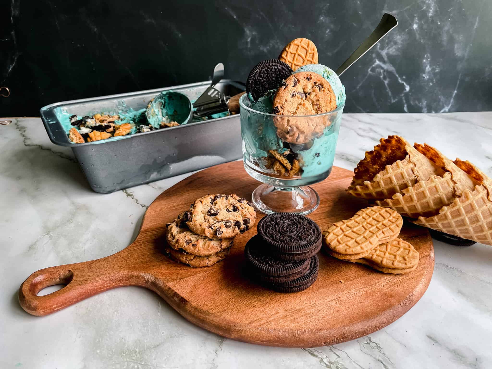 Cookie Monster Ice cream in an ice cream dish with cookies as props