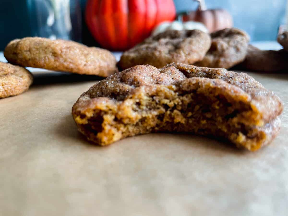 Pumpkin Biscoff Cookie with a bite taken out of it.