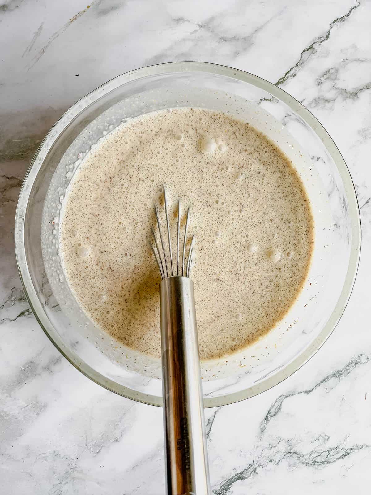 Pumpkin bourbon ice cream ingredients whisked together.