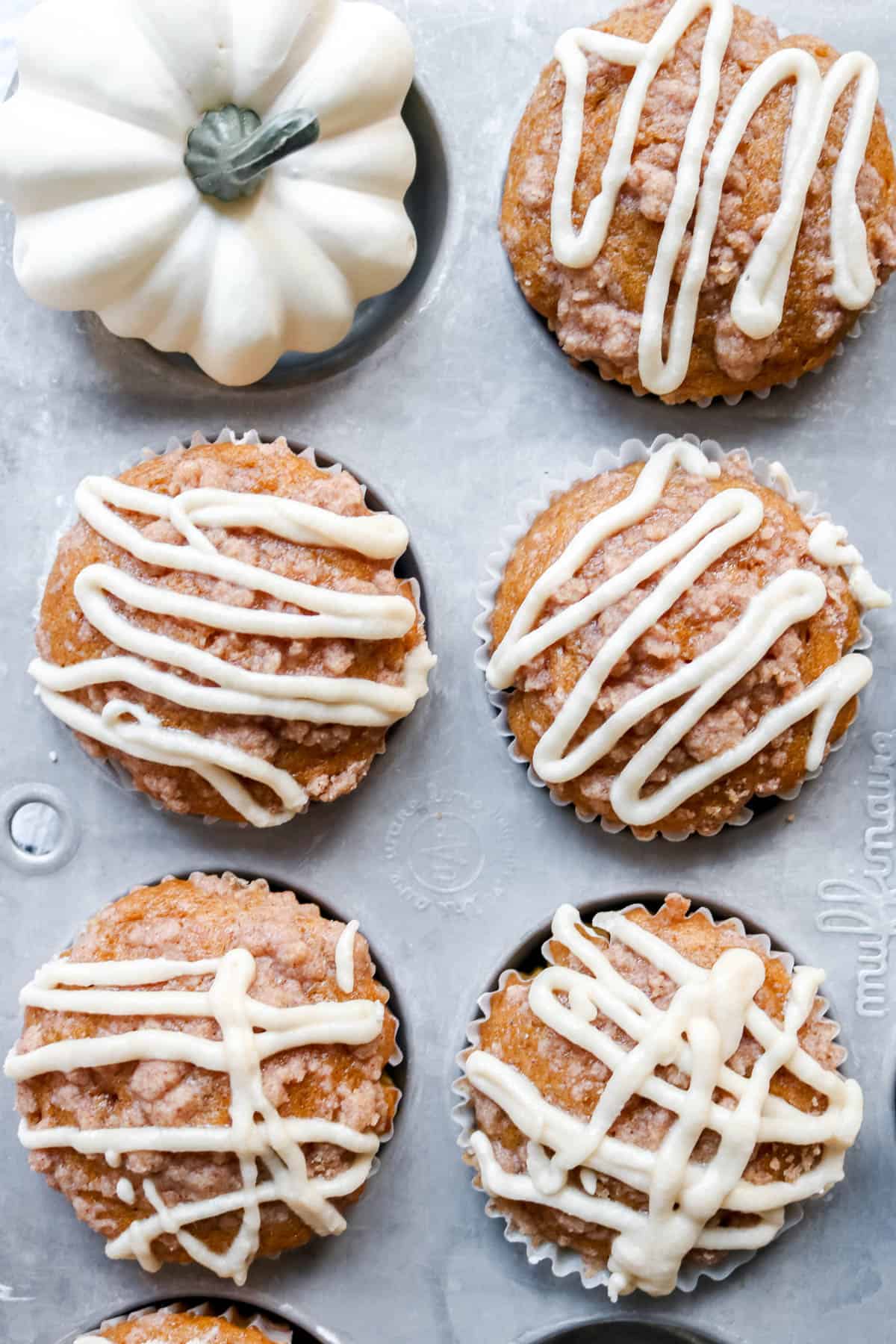 Overhead photo of sourdough pumpkin muffins in muffin tin.