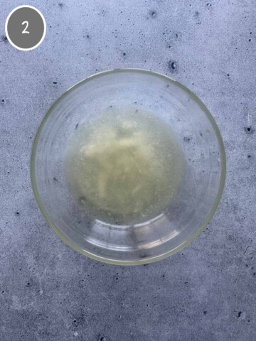 Melted coconut oil in a bowl.