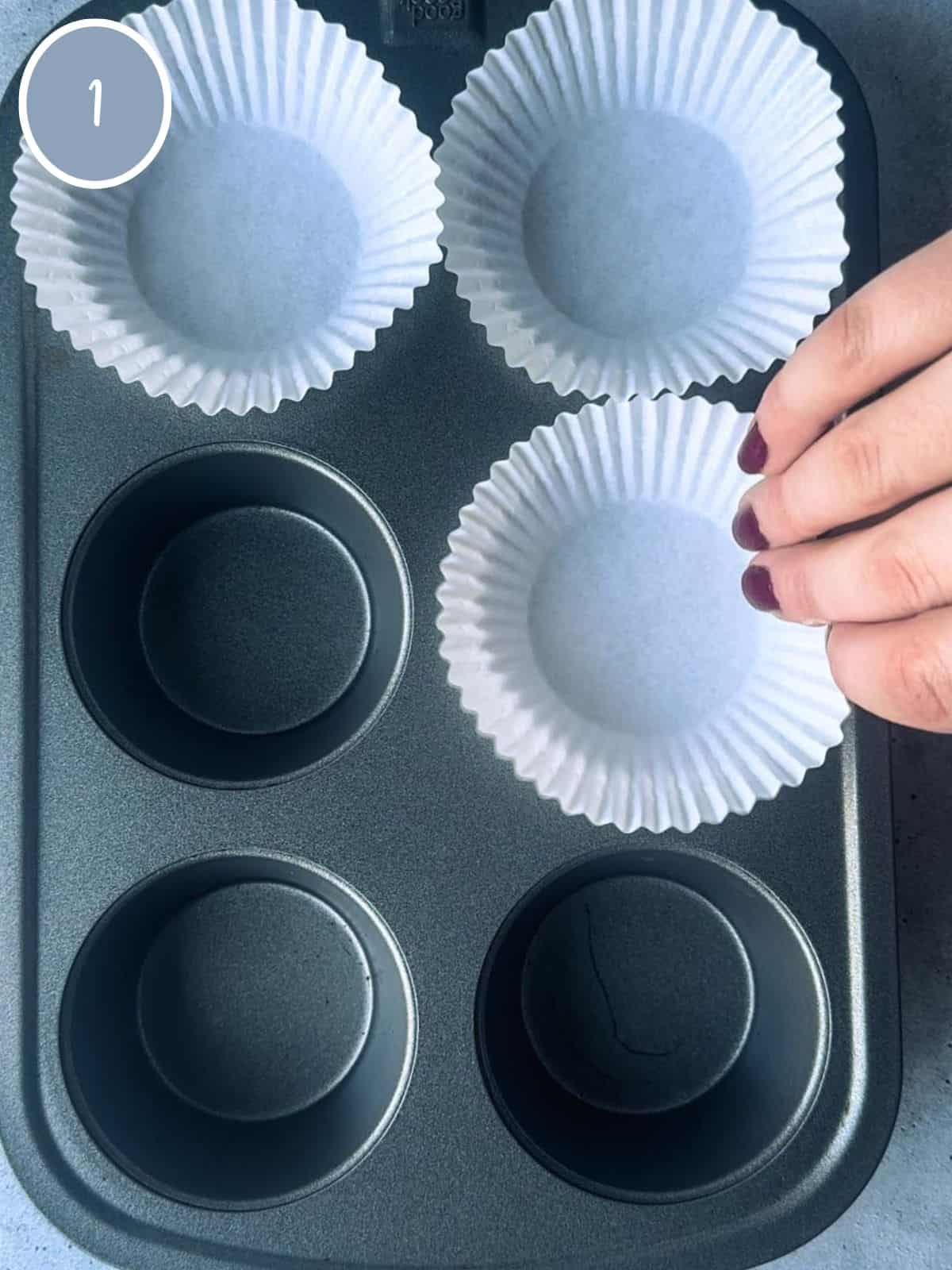 Lining muffin pan.