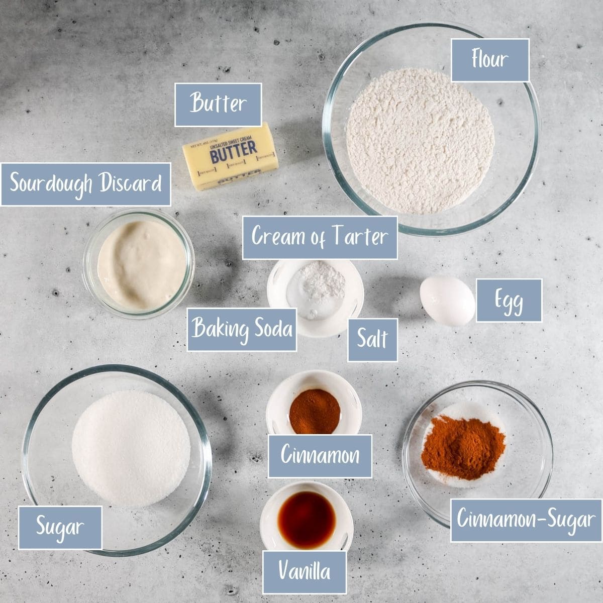 Ingredients with labels for sourdough snickerdoodle cookies.