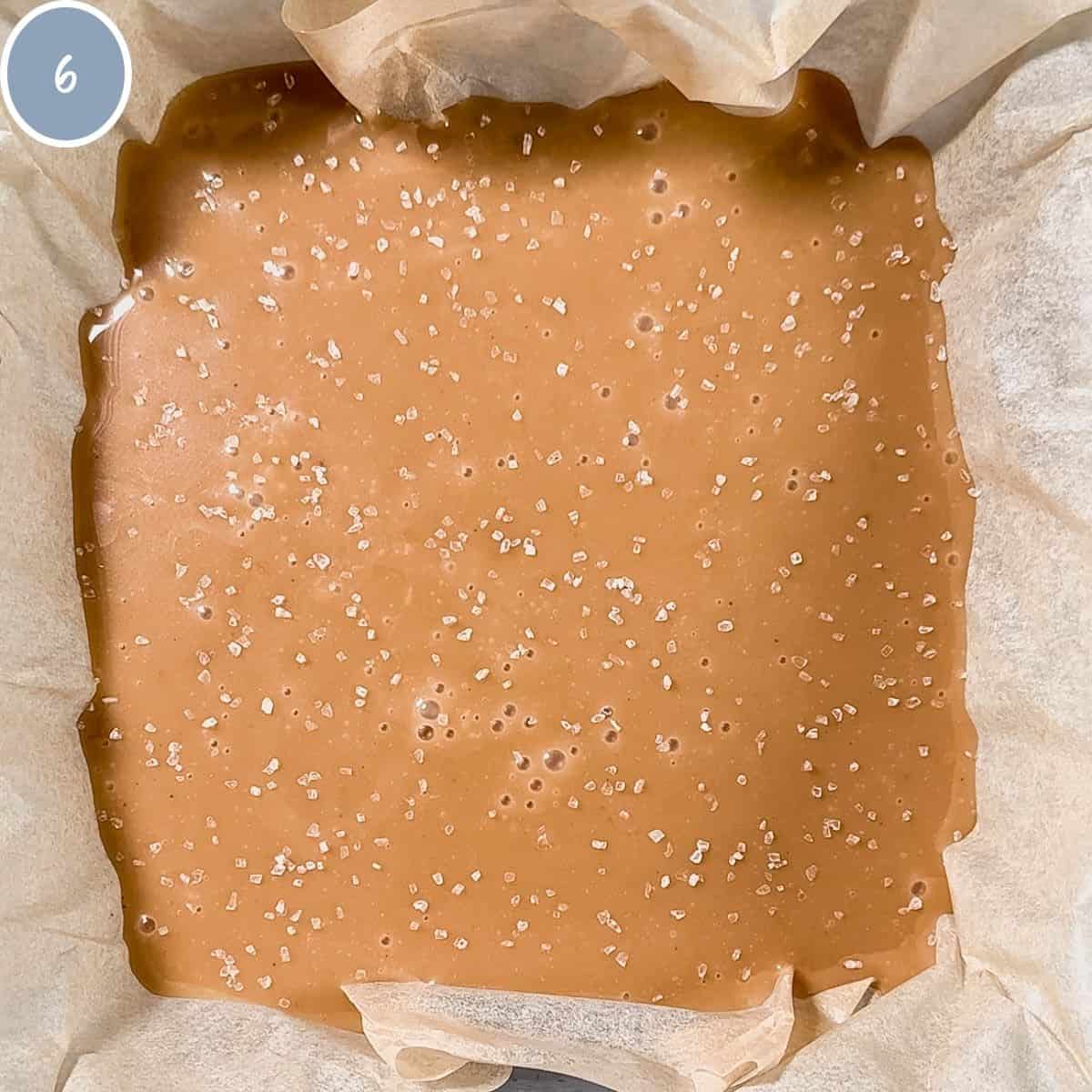 Overhead view of caramels in 8x8 pan with sea salt on top.