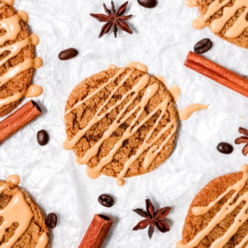 Overhead view of gingerbread latte cookies with cinnamon sticks, coffee beans, and star anise.