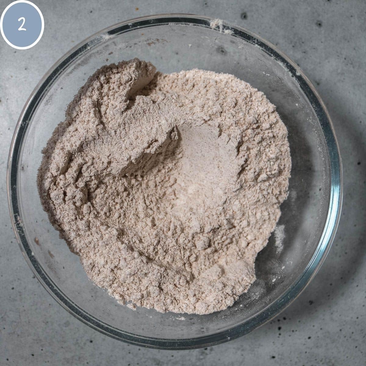 Dry ingredients for cookies combined together in a bowl.