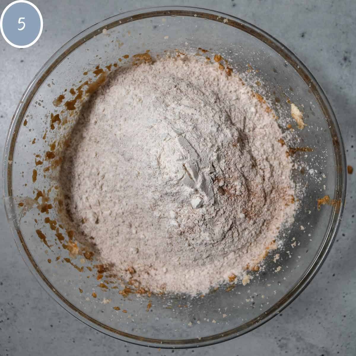 Dry ingredients added to remaining ingredients for gingerbread latte cookies.