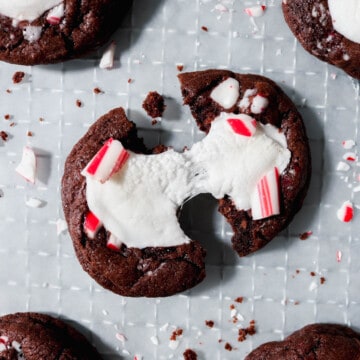 Overhead view of peppermint hot cocoa cookie being pulled apart.