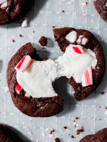 Overhead view of peppermint hot cocoa cookie being pulled apart.