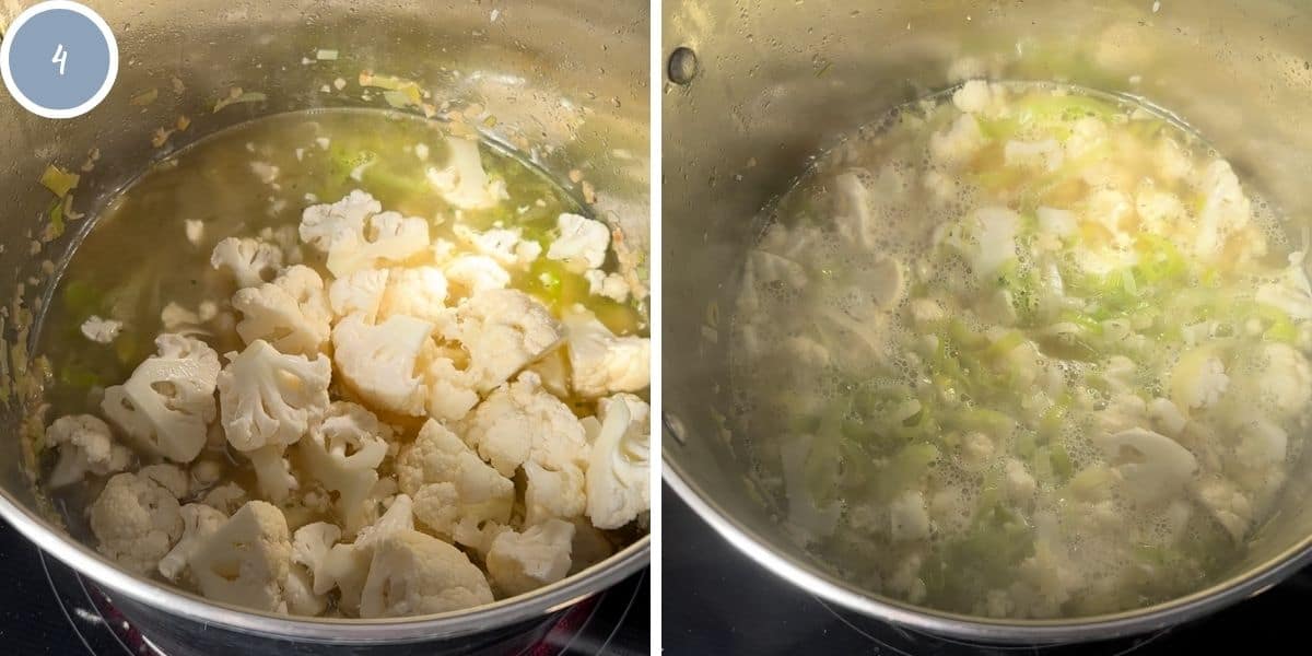 Overhead view of cauliflower cooking in a pot with chicken stock, leeks, and garlic.