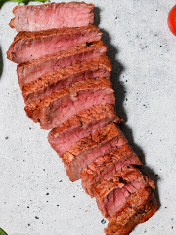 Cooked steak cut into strips.