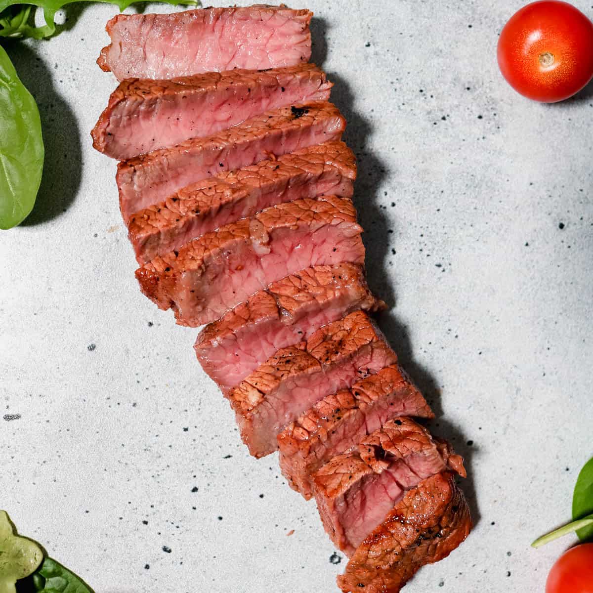 Cooked steak cut into strips.