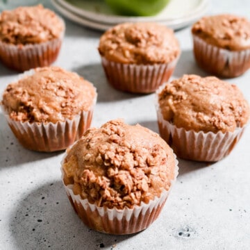 Aesthetic photo of apple sourdough muffins with an oat crumble topping.