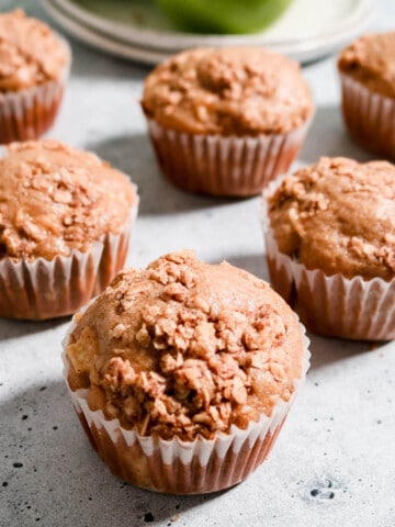 Aesthetic photo of apple sourdough muffins with an oat crumble topping.