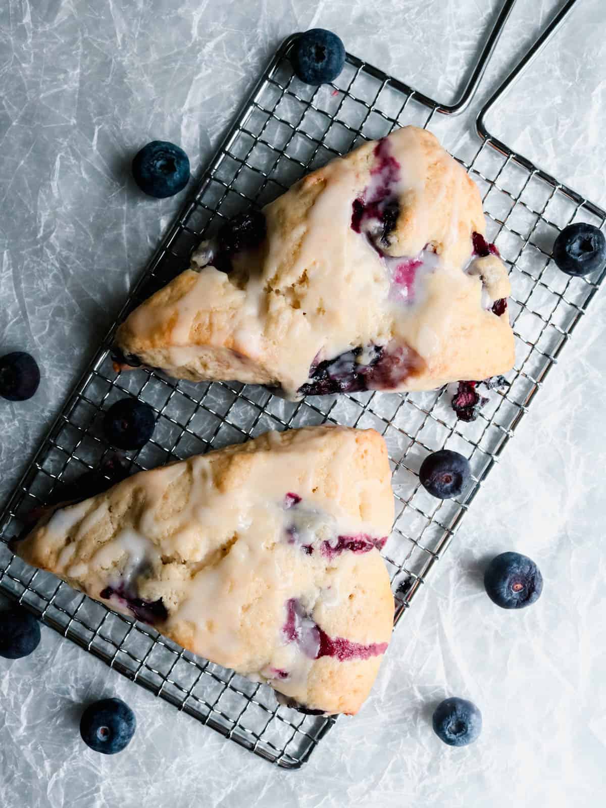 Overhead view of two sourdough lemon blueberry scones.