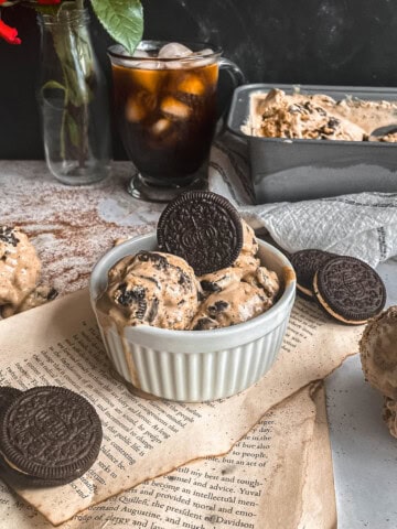 Espresso ice cream with Kahlua scooping into a bowl and in ice cream cones.