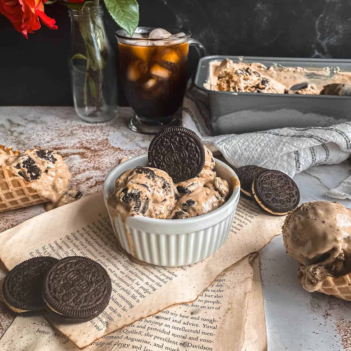 Espresso ice cream with Kahlua scooping into a bowl and in ice cream cones.