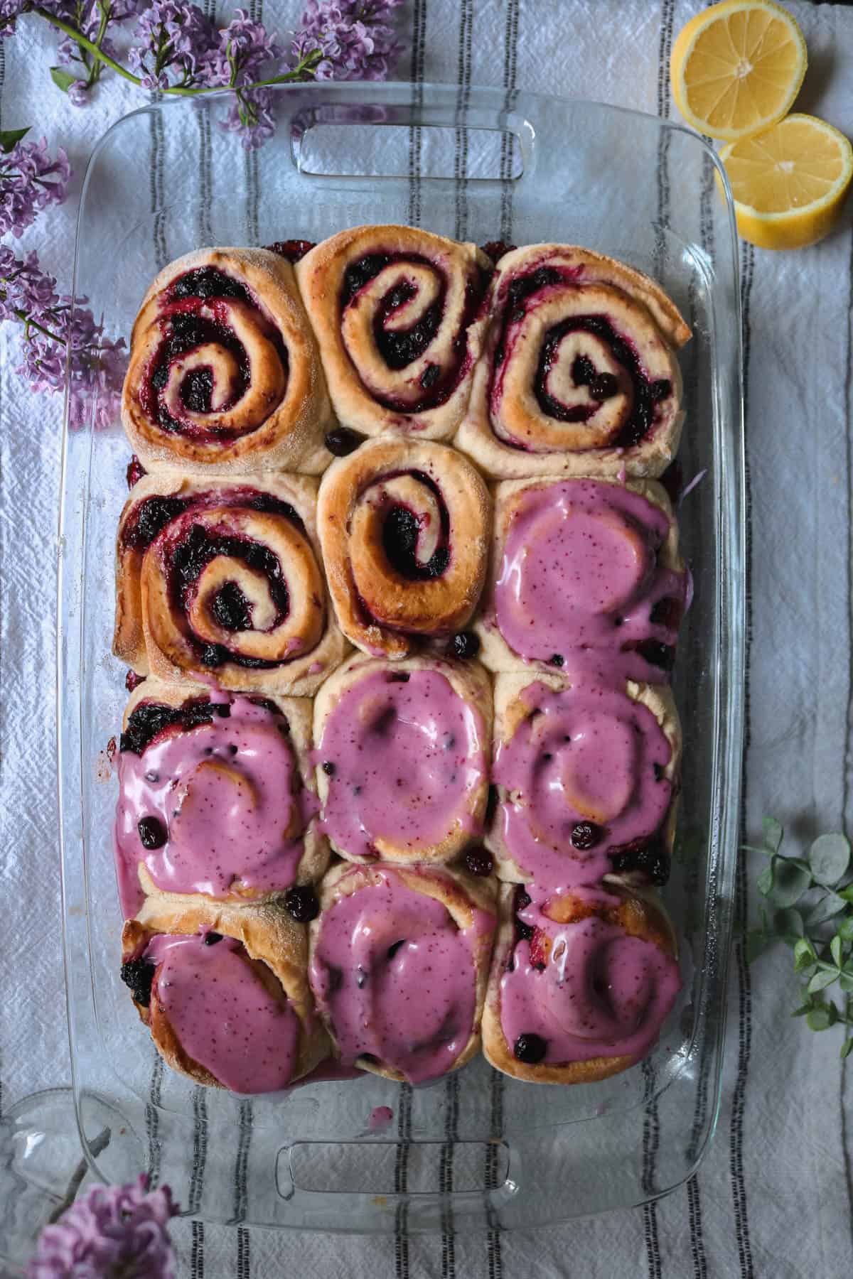 Overhead view of huckleberry sweet rolls in a pan.