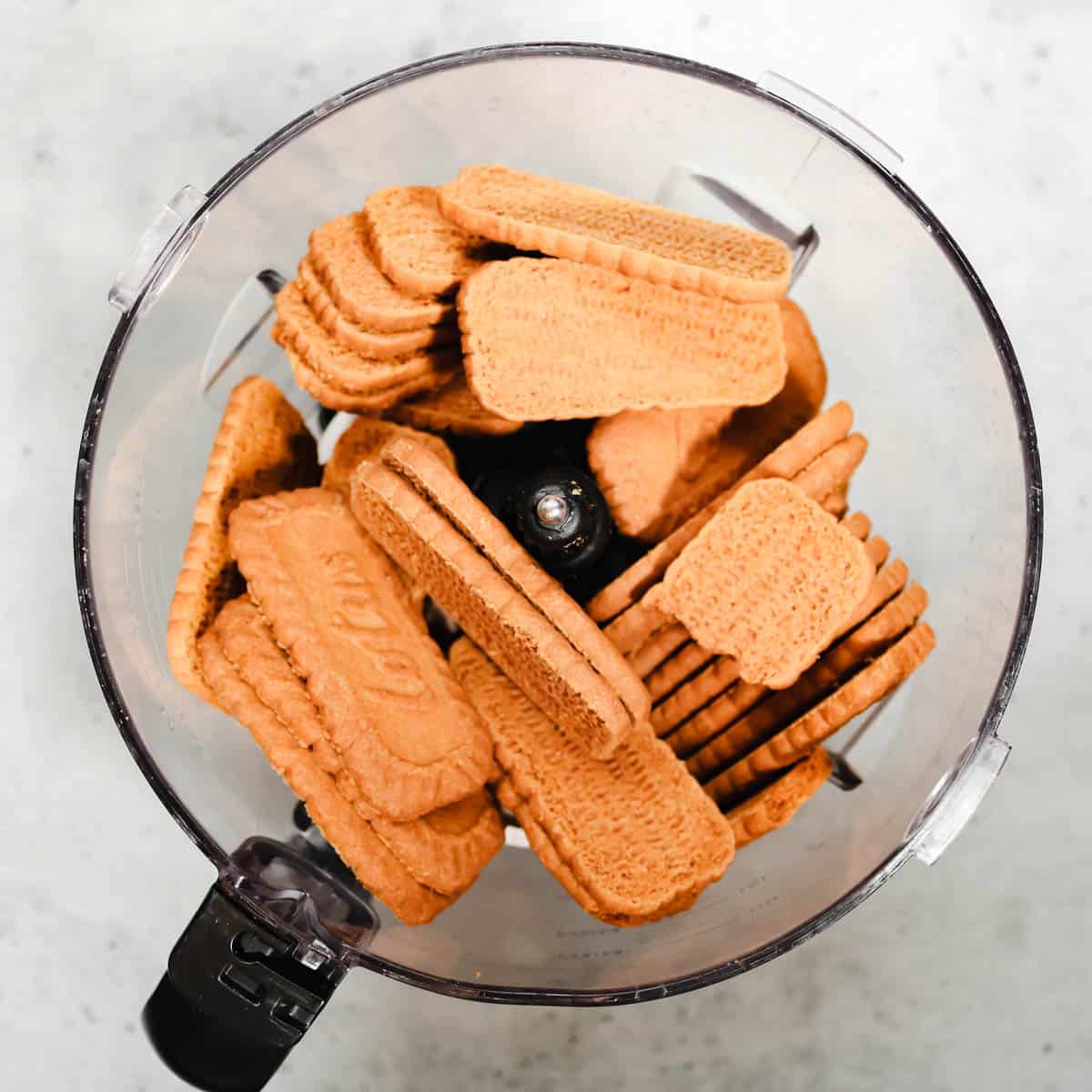 Biscoff cookies in a food processor before being blended.