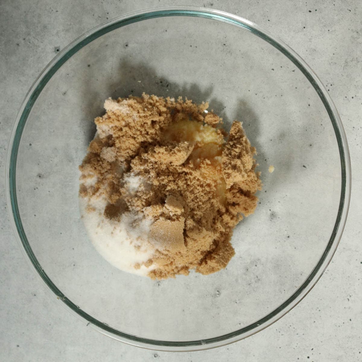 Brown butter and sugars in a bowl before mixing.