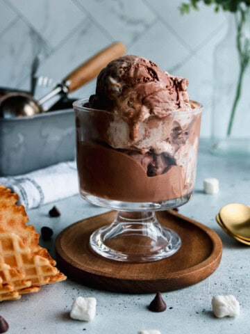 Chocolate marshmallow ice cream scoops in an ice cream bowl.